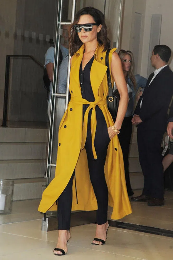 Keep it smart in the heat à la Victoria Beckham in a bright, sleeveless jacket.
Photo: Getty