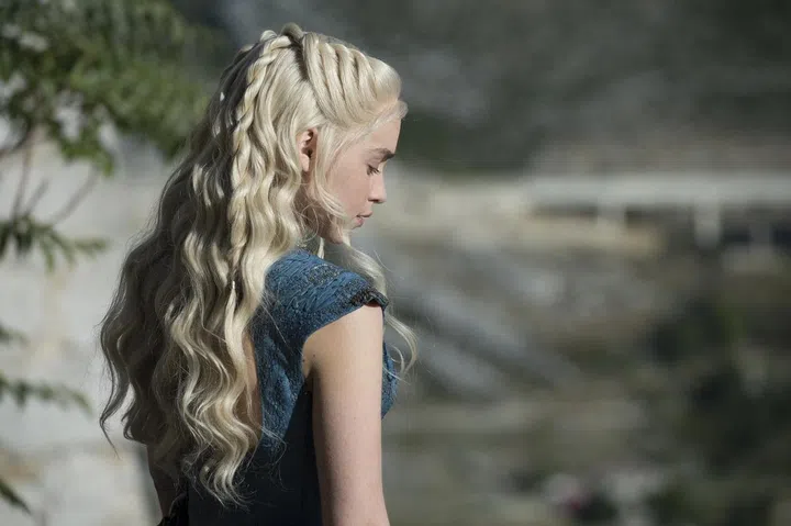 Khaleesi leads the army of Unsullied with her platinum hair in pretty, pulled-back twists