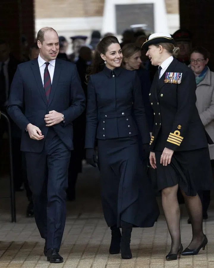Kate Middleton stepped out in a tailored military jacket and matching navy skirt by Alexander McQueen for a visit to the Defence Medical Rehabilitation Centre in Leicestershire with Prince William. The duchess paired her sleek ensemble with suede boots by Ralph Lauren.