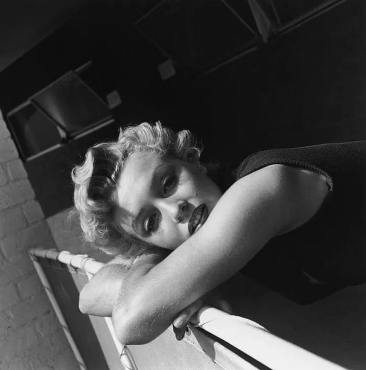 In a sleeveless turtleneck.