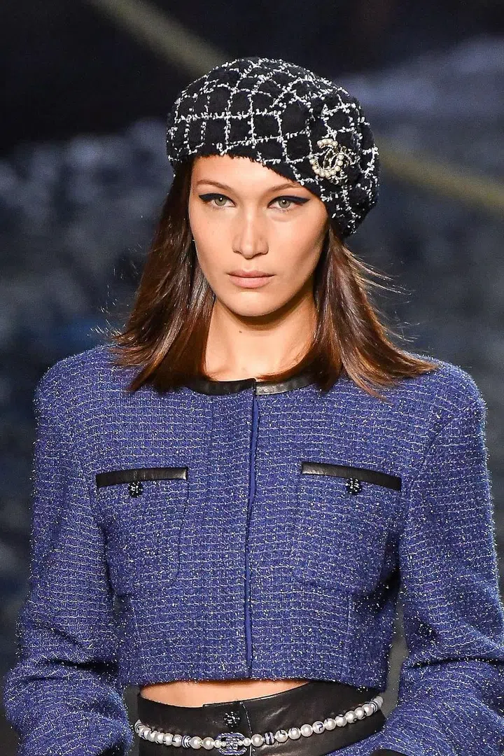 60s vibes for Chanel with the graphic black eyeliner look. Fill in the entire eyelid and extend for a feline flick. Keep the rest of the face bare. Photo: Getty 