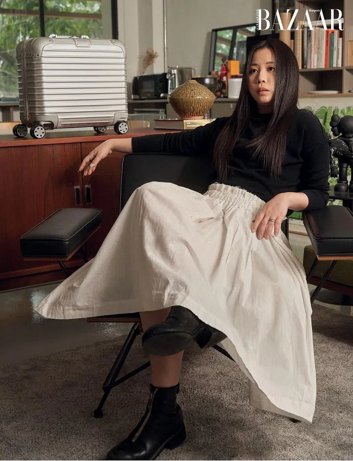 Original Compact suitcase, Rimowa. Top; skirt; rings; boots (worn throughout), Lim’s own. 
