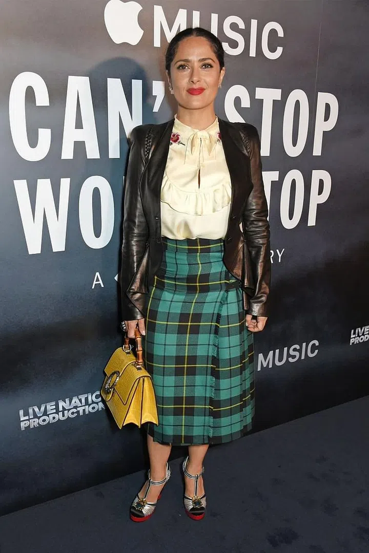 A high-neck pussy bow blouse makes for a flattering cut to style with high-waisted pants or a skirt - especially for those moments you want to hide your cleavage. Photo: Getty 