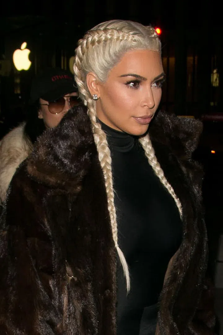 Kim continued to rock the blonde wig, opting for simple braids—a hallmark of her post-pregnancy style. The hair itself came from Pink Couture Hair.