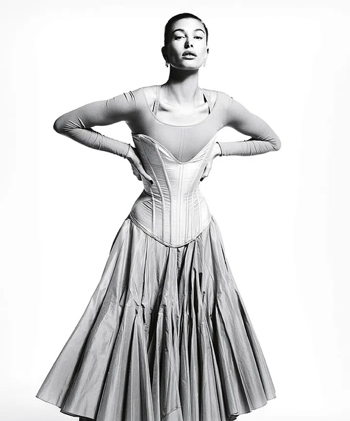 Dior top, bra, and skirt; Period Corsets corset; Harry Winston earrings