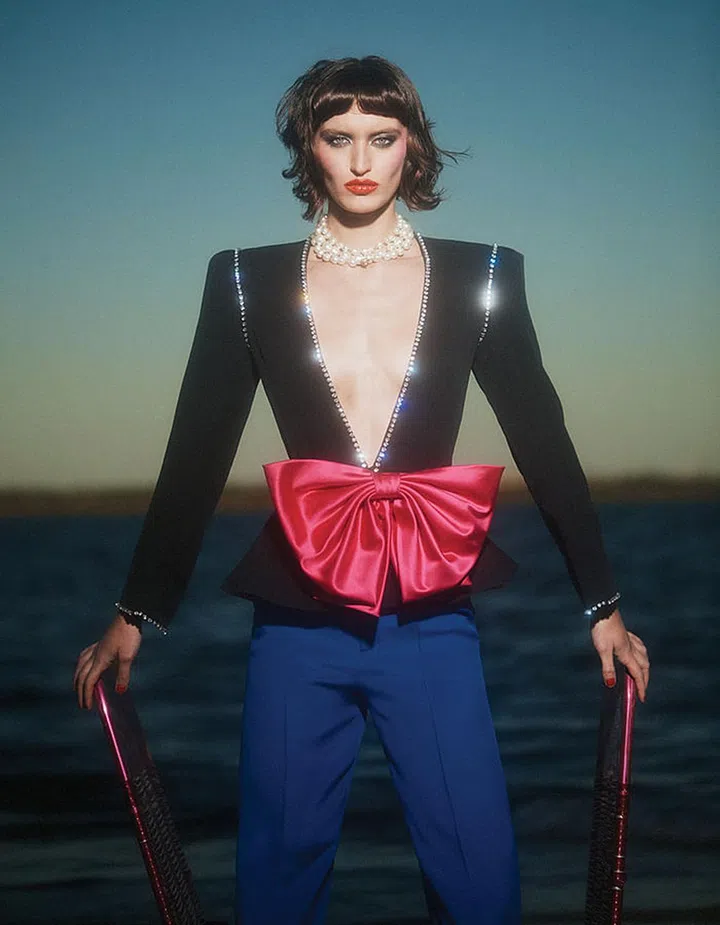 Georgette jacket with rhinestones and silk bow sash; georgette pants; faux pearl necklace
