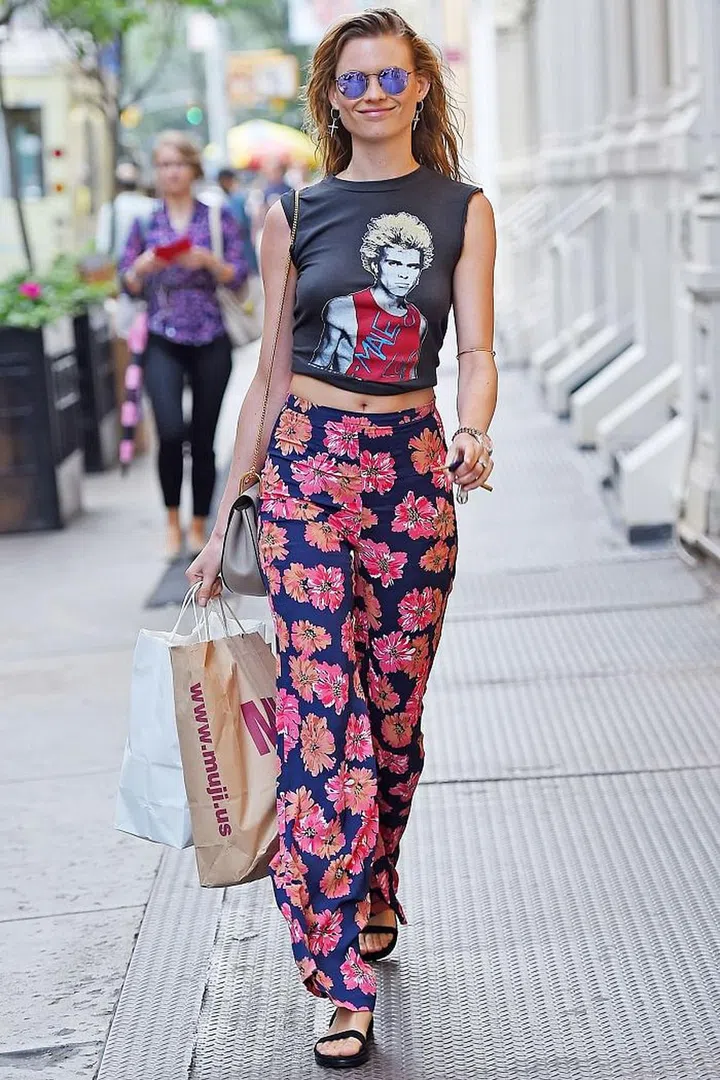 Printed trousers can really pack a punch, as proven by Behati Prinsloo – and they are great for that in between weather. Team with a simple T-shirt and sandals when it's warm, then add Converse trainers and a denim jacket when the evening breeze hits. Photo: Getty 