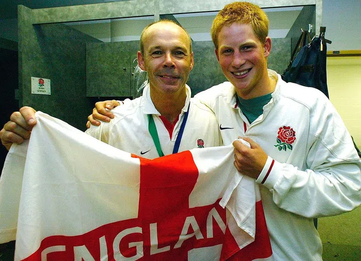 Prince Harry, 19, celebrates Britain's Rugby World Cup win over Austalia with coach Clive Woodward.