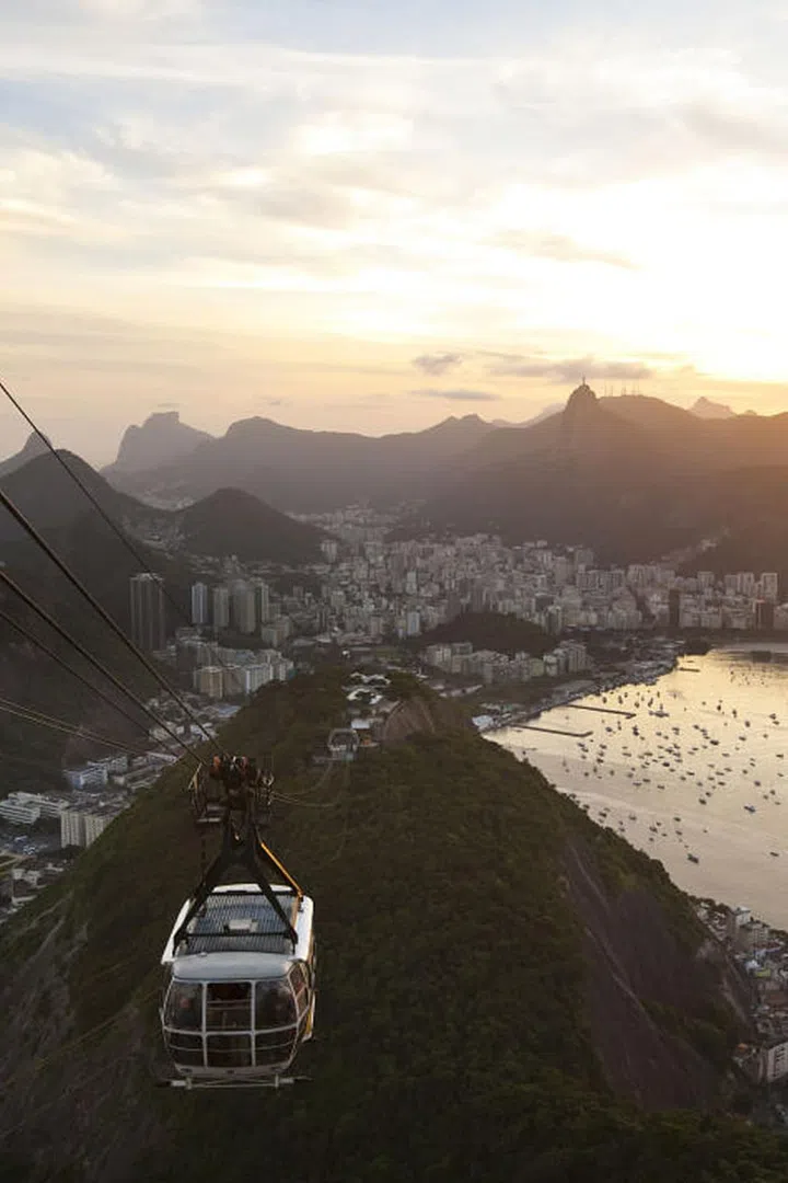 For the best panoramic view of Rio, take the cable car to the top of Sugarloaf Mountain which looms nearly 1,300 feet above the city. Photo: Getty
