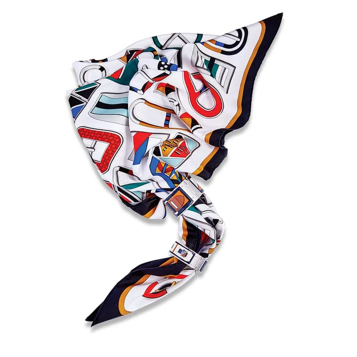 When it comes to statement accessories, less is always more. Our picks? Hermès’ kaleidoscopic silk scarves and enamel bracelets that are oh-so-gloriously luxe and bright. Designed by Virginie Jamin, this graphic print is a vibrant juxtaposition of a vast array of belt buckles—from Hermès’ archives—with geometric shapes. It is perfect for jazzing up any ensemble. 