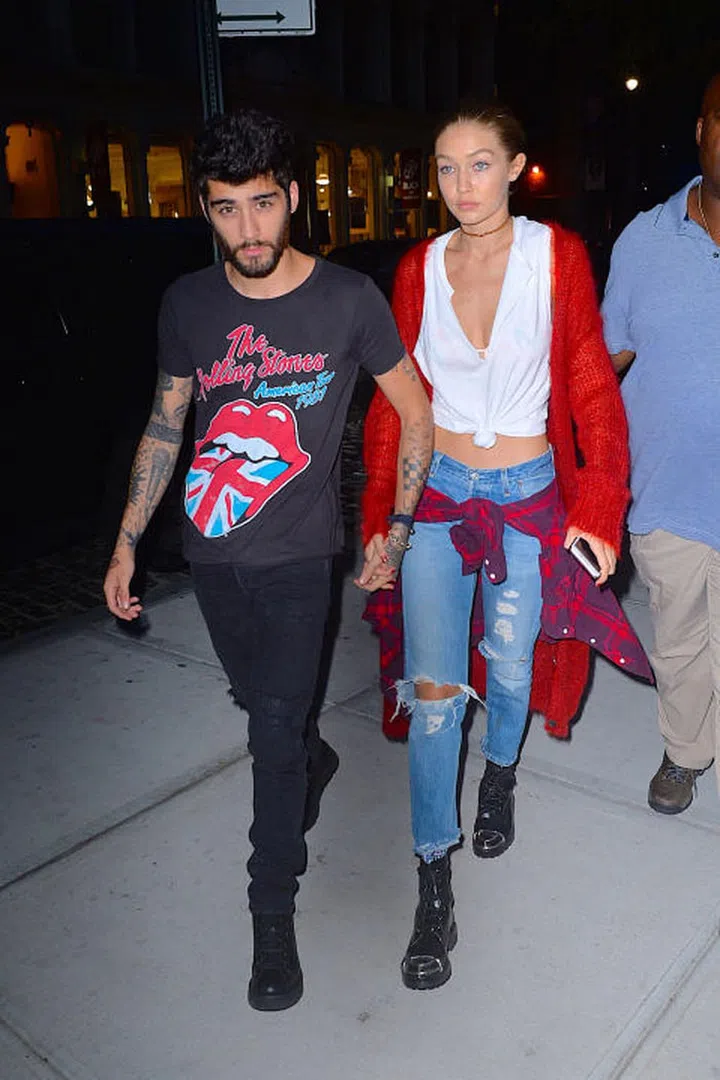 When they both sported red, white and blue (and black) in New York City over the weekend. Zayn's Rolling Stones band tee matched Gigi's red cardigan, cropped tank and jeans combo, all tied together with a flannel at the waist. Photo: Getty
