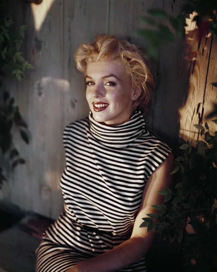 In a striped turleneck dress.