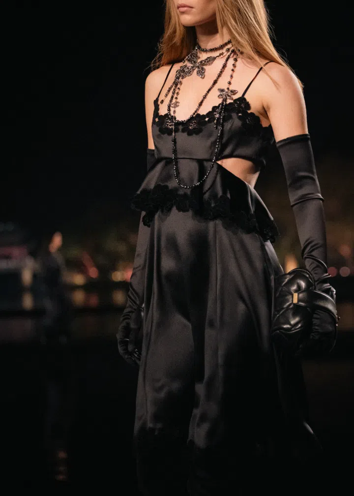 Model wearing a Chanel satin dress