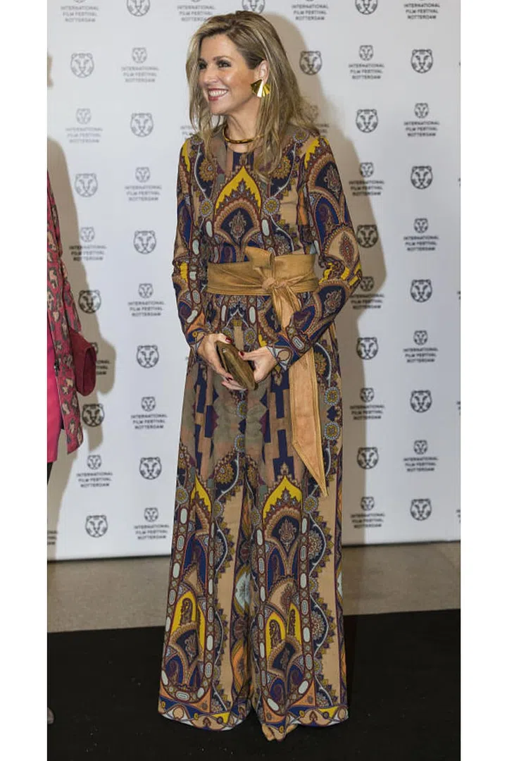 Queen Maxima grew up in Buenos Aires before meeting the would-be King Willem-Alexander at an event in Spain. She's pictured here wearing a bohemian-printed Etro jumpsuit.