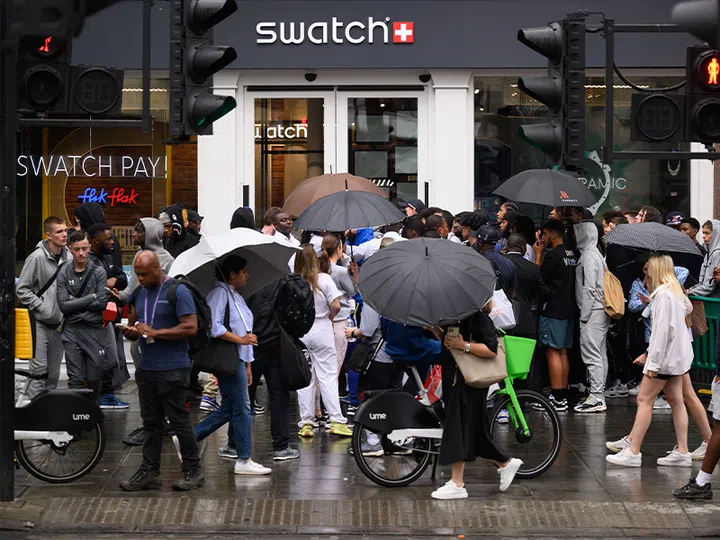 trends from the past watches and jewellery | a crowd gathering outside the swatch store for the moonswatch