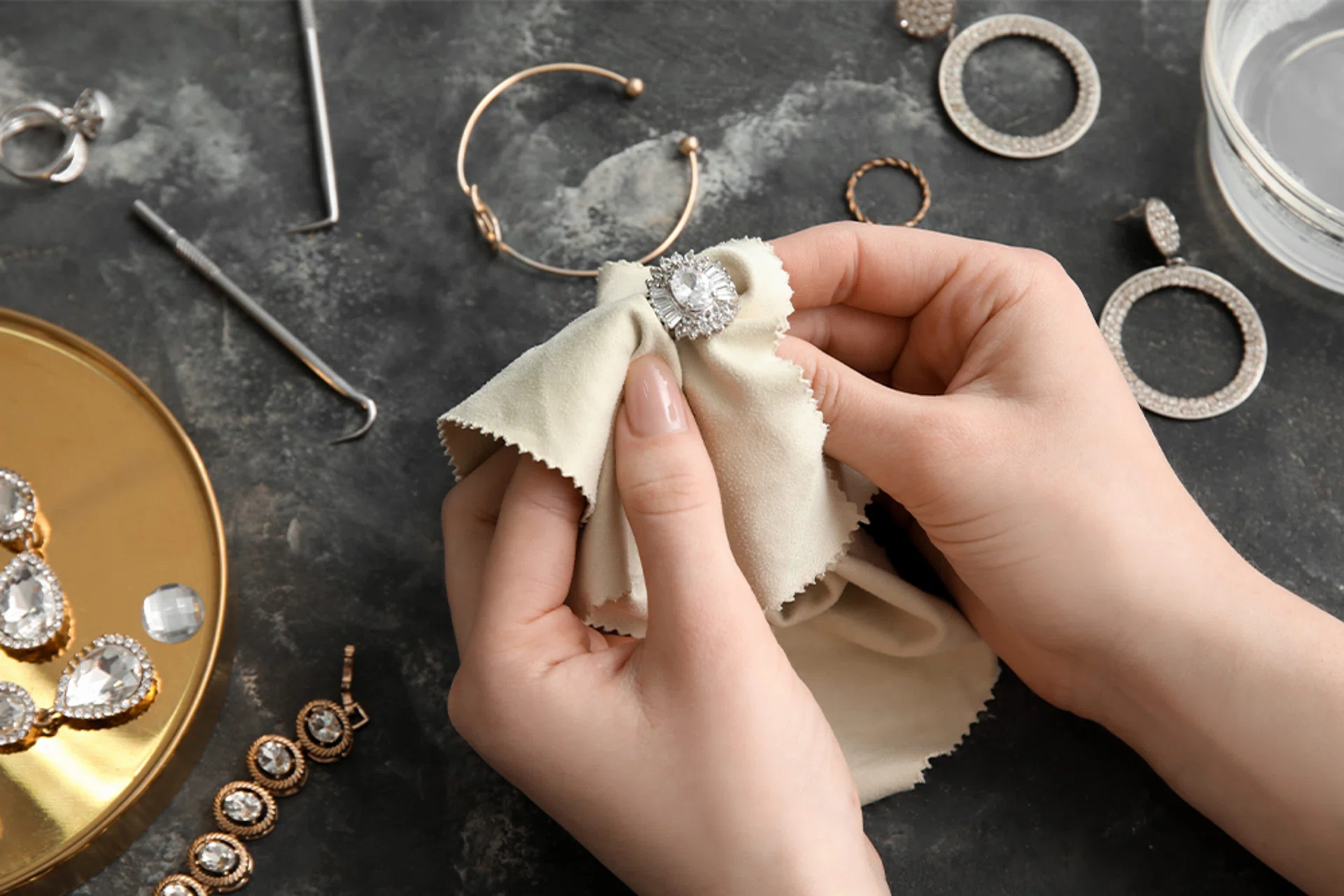 cleaning jewellery with a cloth | Harper’s BAZAAR’s Ultimate Jewellery Cleaning And Storage Guide