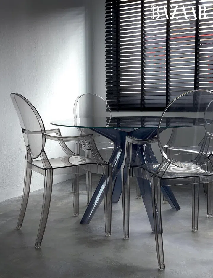 Kartell table and chairs in the dining room.