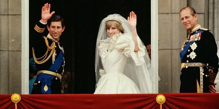 Waving from the balcony of Buckingham Palace after their wedding. Photo: Getty