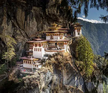 Scott Dunn’s off-beat itinerary includes hiking to the famous Tiger’s Nest Monastery perched on the side of a mountain in Bhutan.