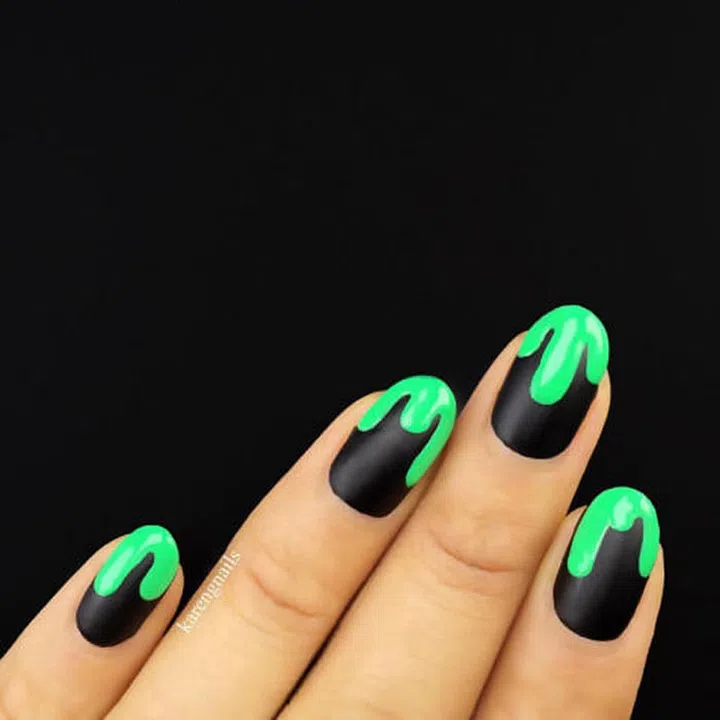 Karen Gutierrez (@karengnails) was inspired by R.L. Stine and his Goosebumps glory for this matte black and neon-tipped dripping manicure. 
