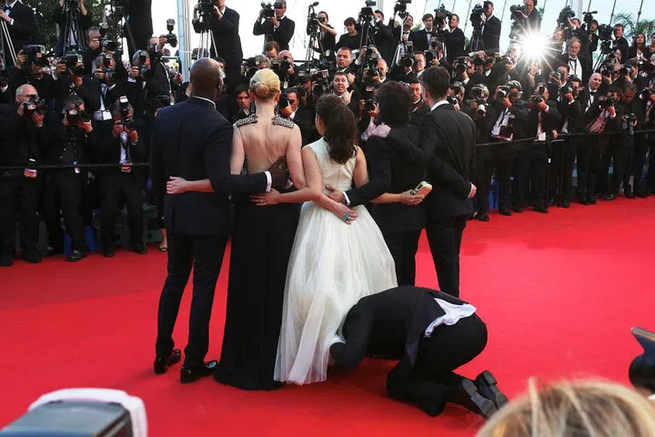 Notorious prankster Vitalii Sediuk snuck under America Ferrera's dress at the How To Train Your Dragon 2 premiere. Photo: Getty