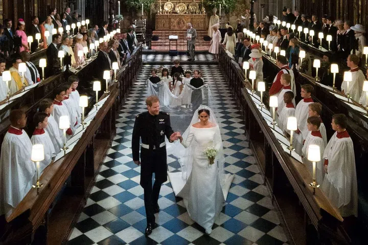 Prince Harry, Duke of Sussex and The Duchess of Sussex leave following their wedding
