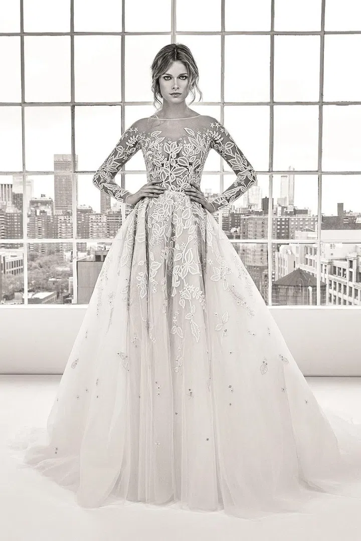 A far more dramatic, sexy and glamorous riff on Pippa's classic look, this illusion bodice and layered skirt with lace appliqués and embroidery is ideal for the bride whose looking to strike the balance between over-the-top glam and traditional elegance.

Zuhair Murad "Deborah" gown, zuhairmurad.com