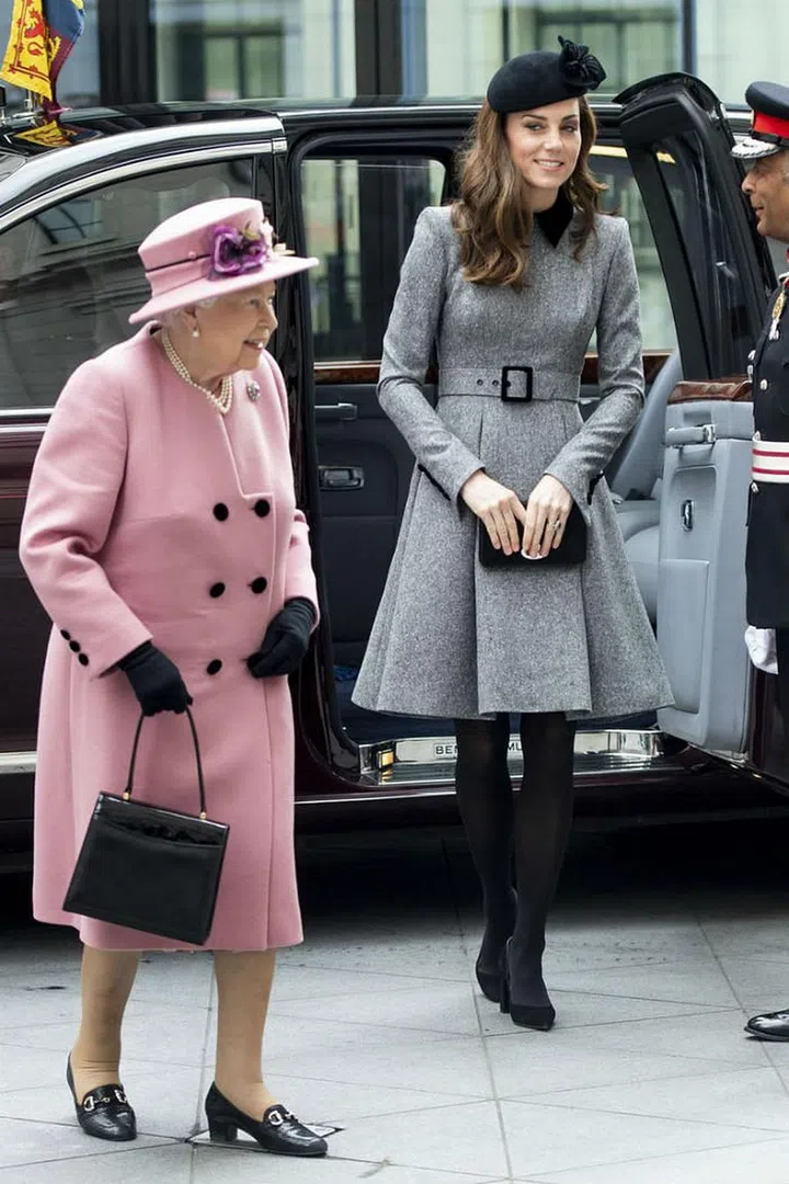 Kate Middleton attended the U.K. Holocaust Memorial Day Commemorative Ceremony in Westminster on Monday with the Queen and Prince William. She was spotted wearing a gray Catherine Walker belted coat with a black hat, tights and pointed-toe pumps. 