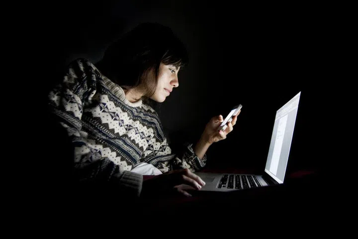 "It's very easy to get sucked into the web, work, social networking, and texting at night—all of which is overstimulating (and can alter your body's release of melatonin in some cases). It's important to set limits and unplug at least one hour before bed to allow your mind to settle down. Don't check work email before bed. It will only start your mind buzzing and there's no real action you can take in the middle of the night. Let it wait until morning." Photo: Getty