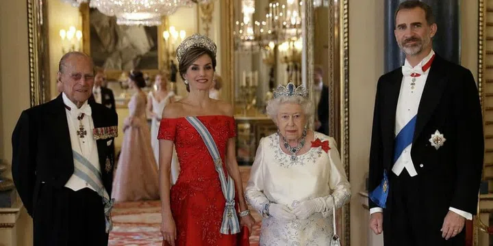 Queen Elizabeth II, Prince Philip, King Felipe VI of Spain, and Queen Letizia of Spain pose for a photo before a State Banquet at Buckingham Palace in London.