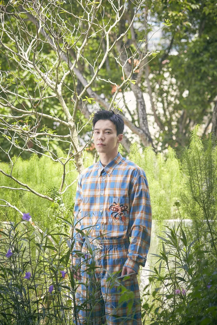 Wong, in a Gucci shirt and shorts, in his garden. Photo: Veronica Tay.