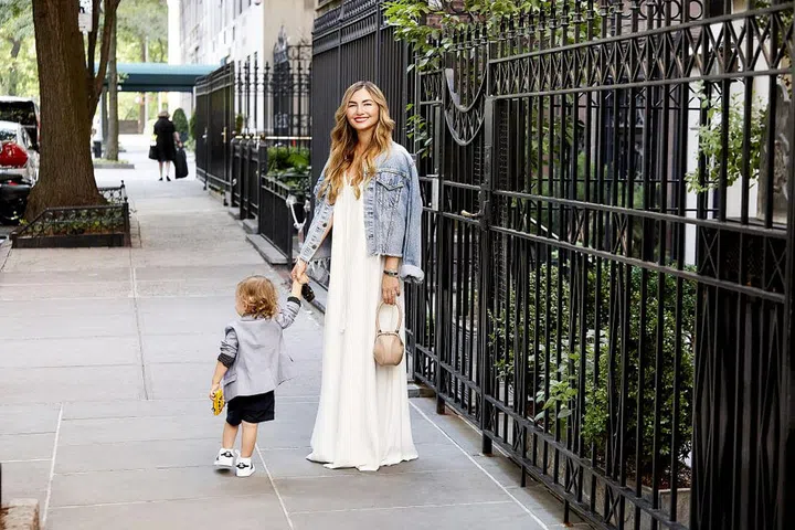 "The easiest outfit for me when playing outdoors with my son is a long maxi because it's effortless yet still so chic."
How would you describe Dallas style?
I feel women in Dallas love unique one-of-a-kind pieces and are not afraid to take risks.
One piece you're buying/bought this season to update your look?
Those amazing Valentino maroon patent leather coat and ballerina inspired booties. I cannot wait to get them. Pictured: Adam Lippes dress; Gabriela Hearst handbag; Vintage denim jacket. Photo: Chris Clinton