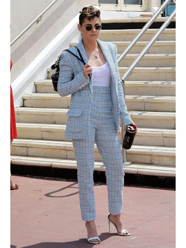 8 May: Kristen Stewart also opted for a trouser suit in the form of this tweed offering by Chanel. She paired it with strappy heels and a chic backpack.

Photo: Getty