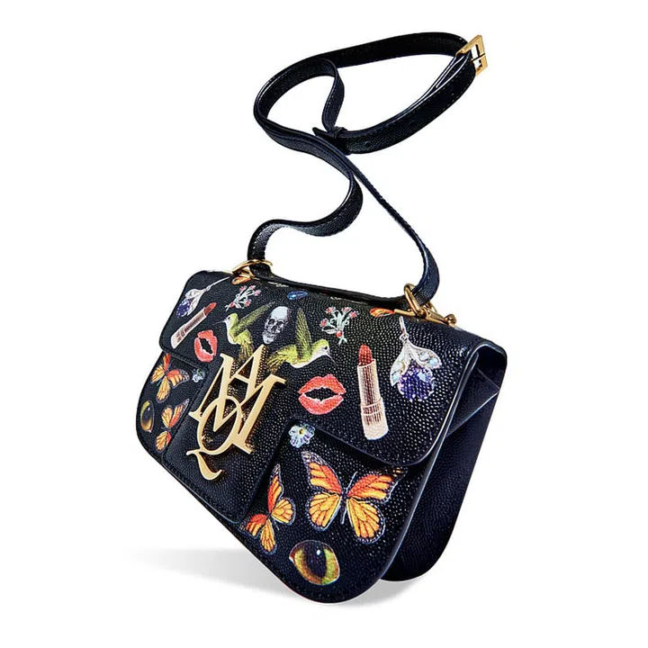 We’re calling it now: Alexander McQueen’s new Insignia Satchel is fashion’s next It bag. 
Ideal for languid brunches or elegant dinner parties, this striking day-to-night piece is crafted from luxurious materials such as stamped suede, patchwork python and grainy leather.