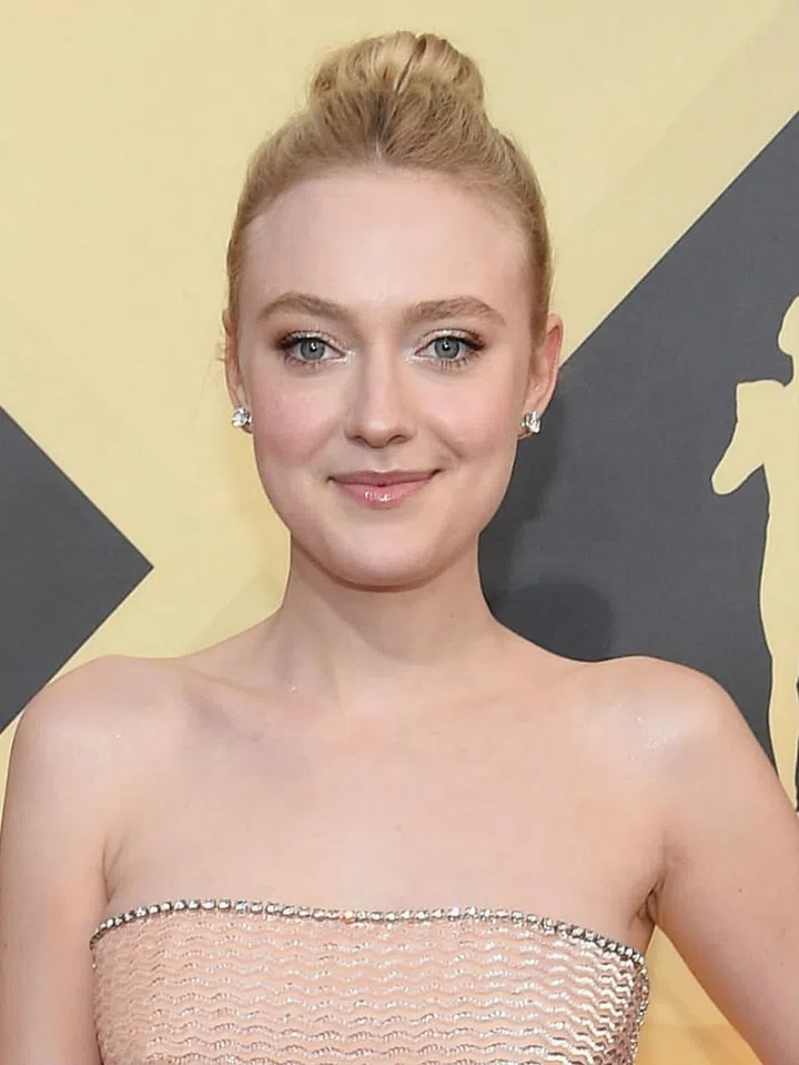 With a sleek bun, wispy lashes and glowing skin, Dakota Fanning is a ballerina dream come true.