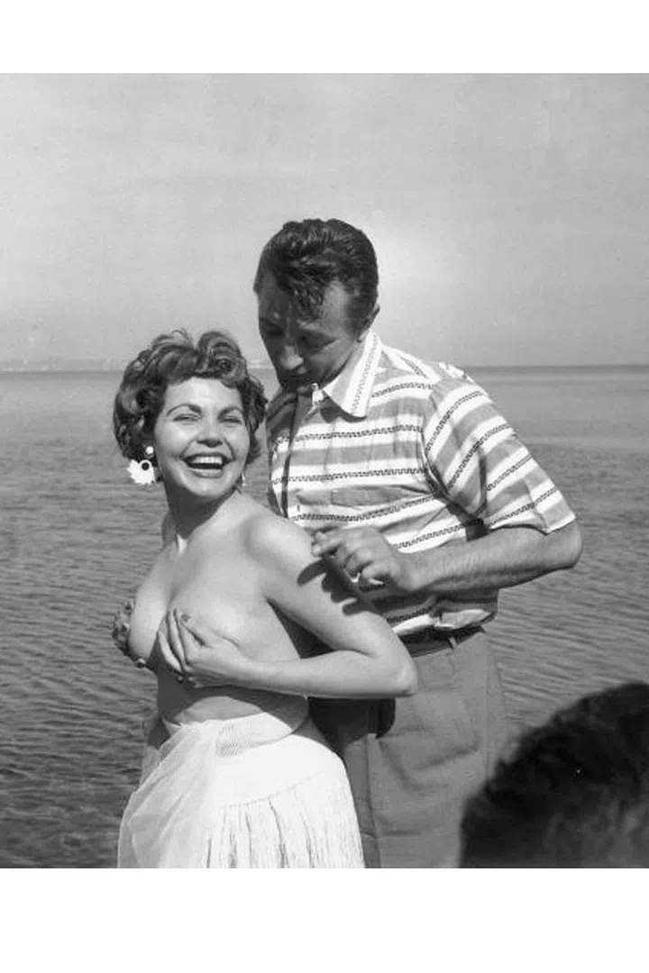 When Simone Silva posed topless at Cannes, she inspired a melee where one photographer broke his arm and another broke his leg. She was later asked to leave the festival. Photo: Getty