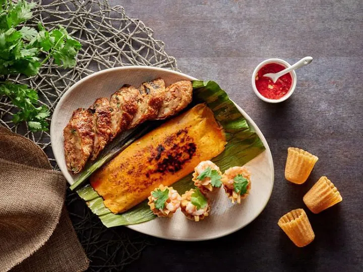 Indigo Blue Kitchen’s Indigo Platter For Two, comprising ngo hiang, otah and kueh pie tee.

Photo: Courtesy
