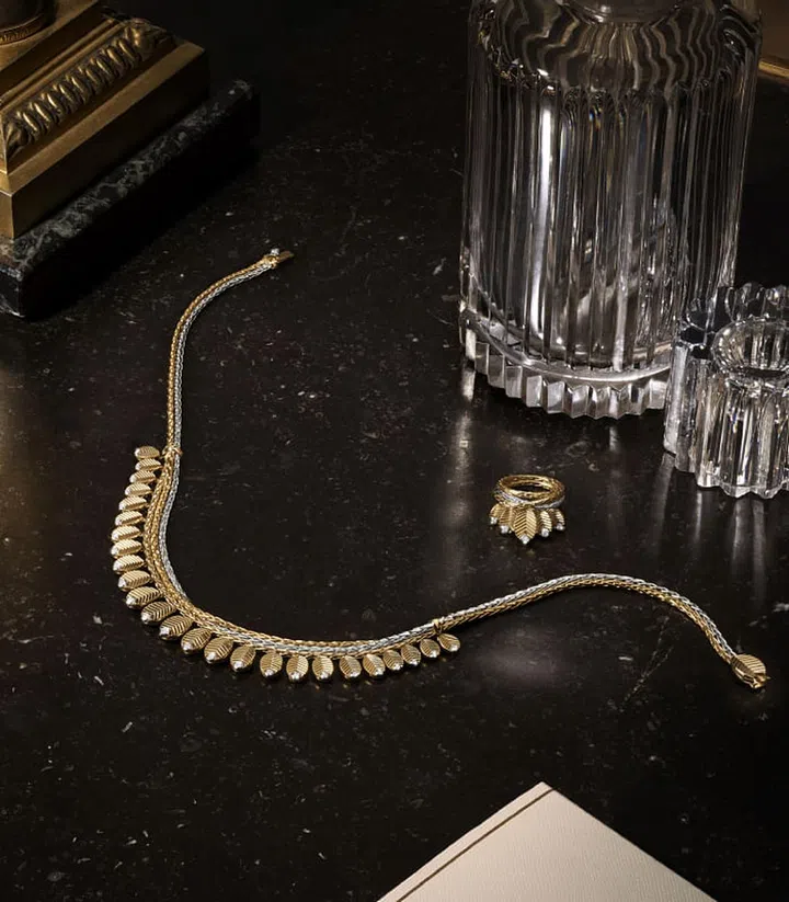 The Grain de Café choker necklace and ring from Cartier's fine jewellery collection. Photo: Cartier
