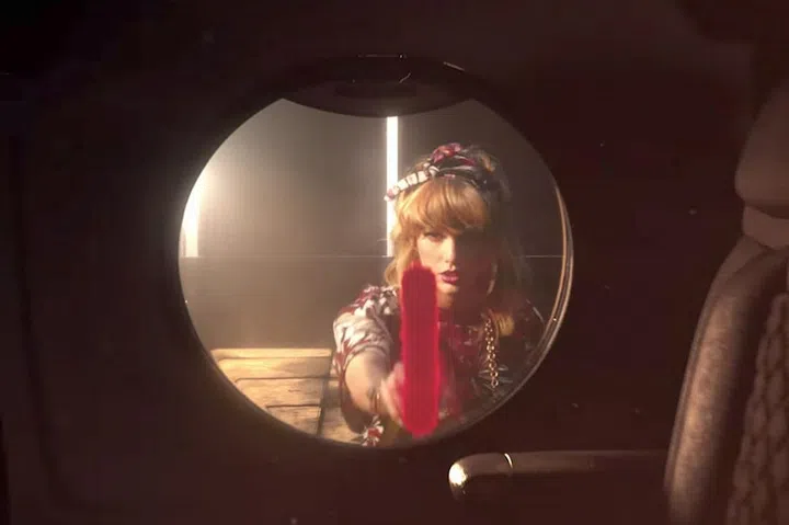 With thick, blunt bangs and a scarf to tie back her waves, delinquent Taylor can now spray paint "reputation" on the side of her plane and saw off its wings without her hair getting in her face. 