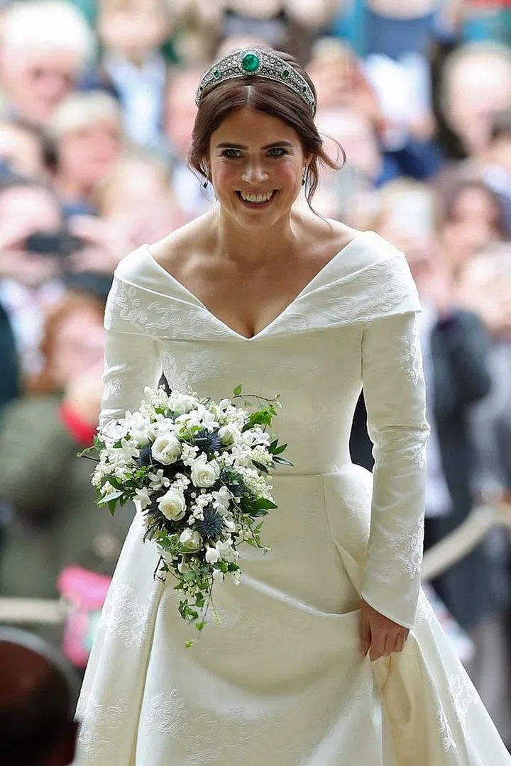 The stunning bride in a portrait-neckline gown by Peter Piloto and the Grenville Tiara.