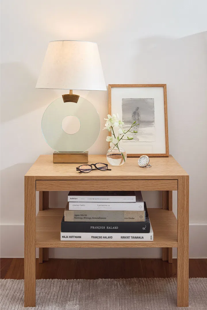 Andre Wu's custom-made lamp with artwork by Antony Gormley and an Hermès clock.