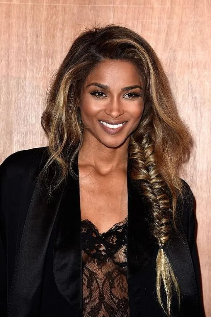 "A sleek or messy fishtail braid is fantastic for outdoor weddings where hair risks getting wind-blown," says Alcala. "Incorporating a braid can also add an element of youthfulness and playfulness." Photo: Getty 