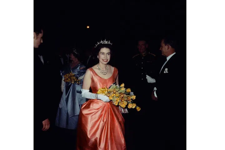 The Queen attends a performance at London's Royal Academy of Dramatic Art, November 1964.