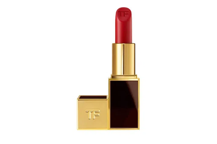 "A bit of red can really perk you up while traveling. This one's a great moisturizing lipstick that can double as a lip balm." ; Photo: Courtesy of the designers
