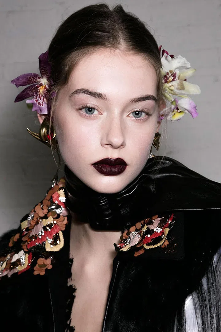 Switching to a darker lipstick for fall? Not exactly groundbreaking. But when it's closer to black on the color spectrum than it is to red? Now we're onto something. You don't even have to go as goth as the Marc Jacobs mouth or as dark as Peter Philips did at Dior (he filled in the lips with black eyeliner before going over them with Poison, an aptly-named shade of lipstick out in the fall), to get what James Kaliardos calls the "don't-mess-with-me, I'll-kick-your-ass look," seen here at Rodarte.
Photo: Imaxtree