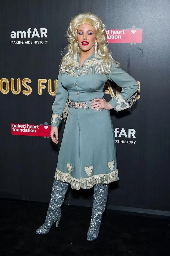 as Dolly Parton at amfAR's Halloween party. Photo: Getty