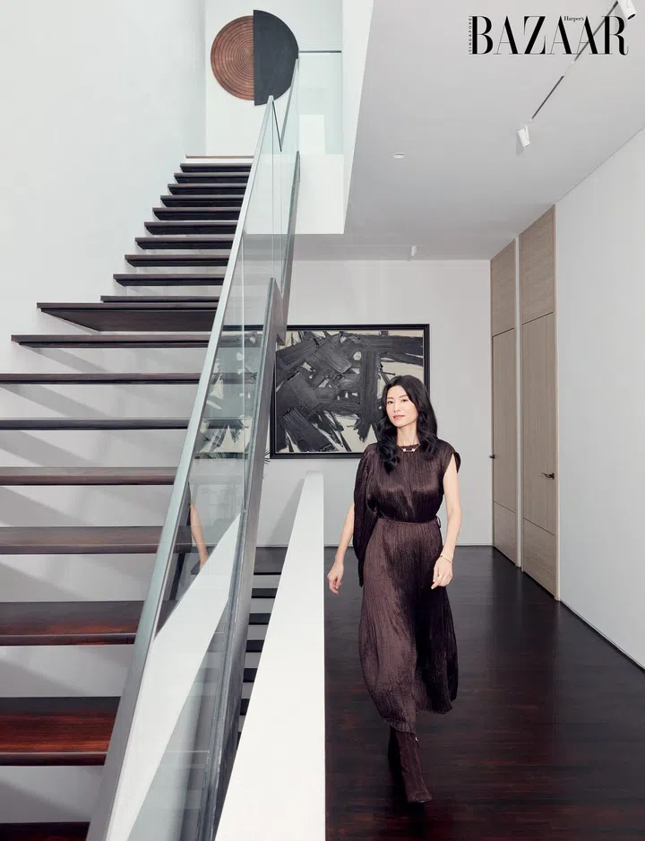 Claire Wu in the hallway of her home wearing a dress and boots by Hermès, and her own Van Cleef & Arpels necklace, Cartier bangle and Monica Vinader rings (worn throughout. Photo: Gan