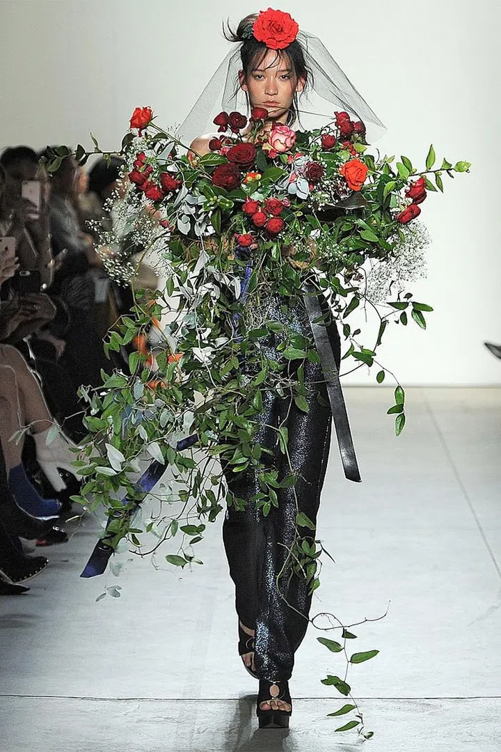 Major props if you can find the right occasion to hold a large bouquet of roses against your chest instead of wearing an actual shirt—also, please invite me to said occasion. Photo: Getty