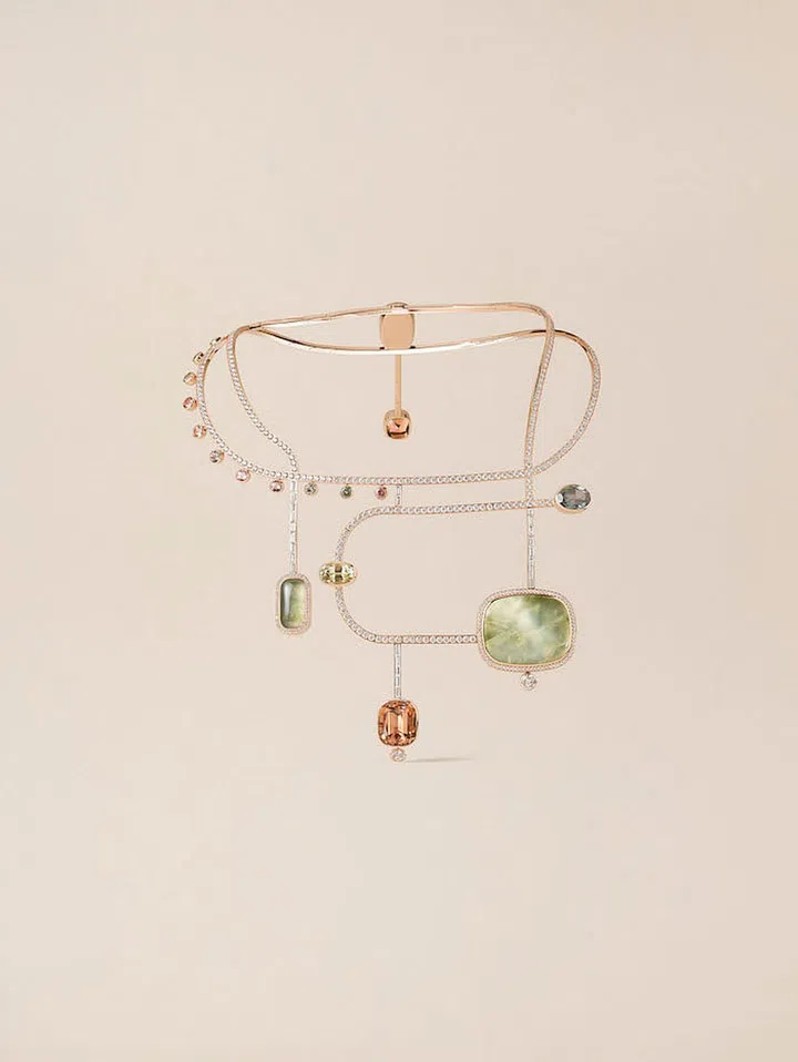 The rose
gold À l’Écoute necklace with a 53.4-carat prehnite cabochon and a 21-carat cushion-cut tourmaline. (Photo: Hermes)