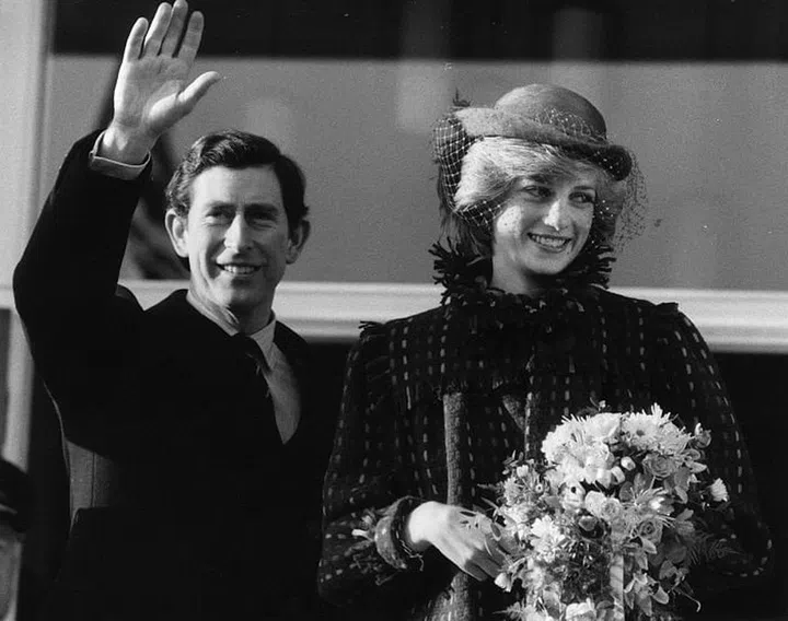 Waving and smiling at a crowd. Photo: Getty 